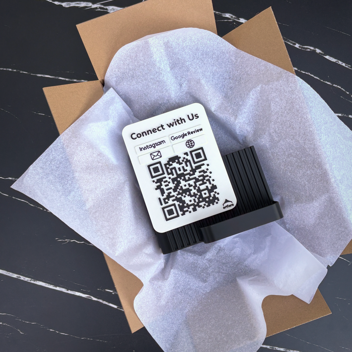 Shopkeeper QR sign unboxed in tissue paper inside its shipping box