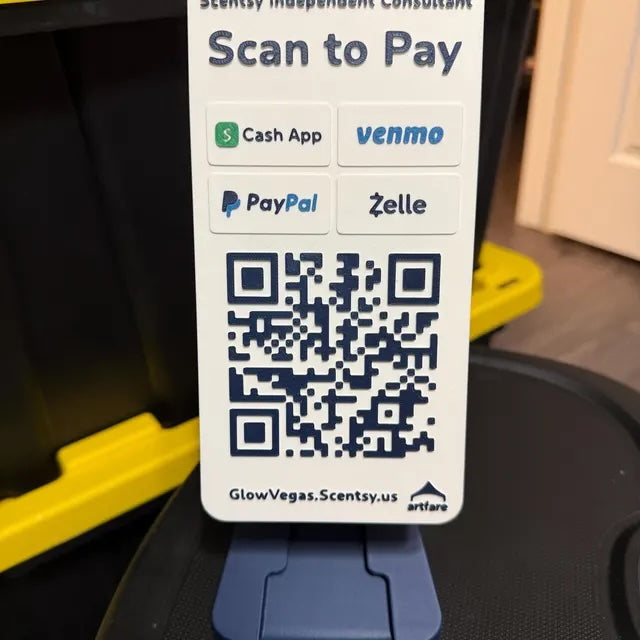 Artfare QR payment sign in use at service counter