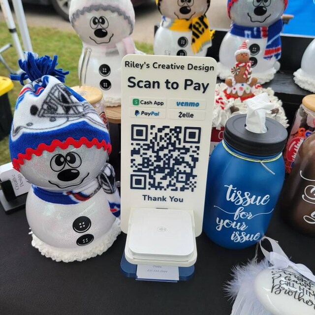 Artfare QR payment signs displayed at vendor booth