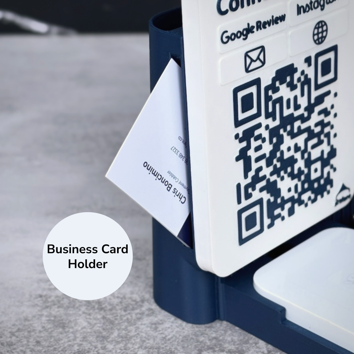 Close-up of the business card holder on the side of a navy Shopkeeper Square Reader dock