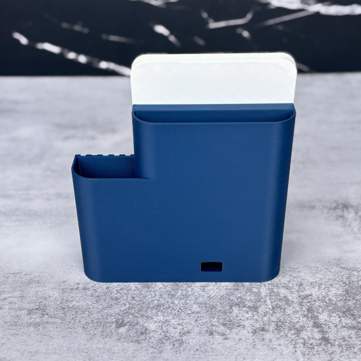 Back view of the navy Shopkeeper Square Reader dock with cord opening and organizer compartments