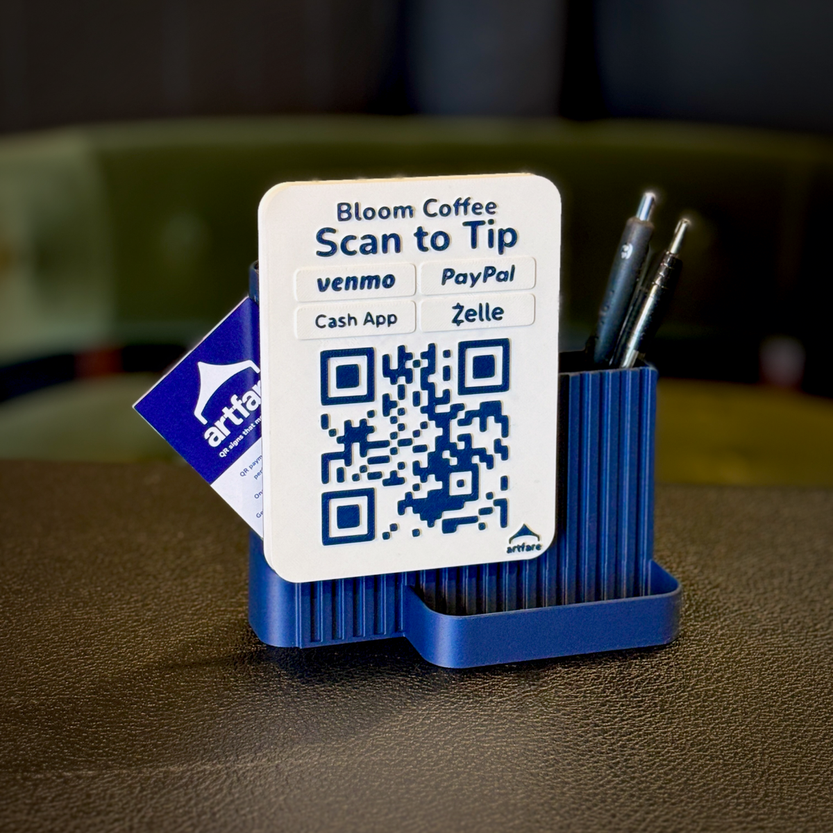 Navy Shopkeeper Scan to Tip sign for Bloom Coffee with Venmo, PayPal, Cash App and Zelle, pens in the organizer and business cards in the side holder