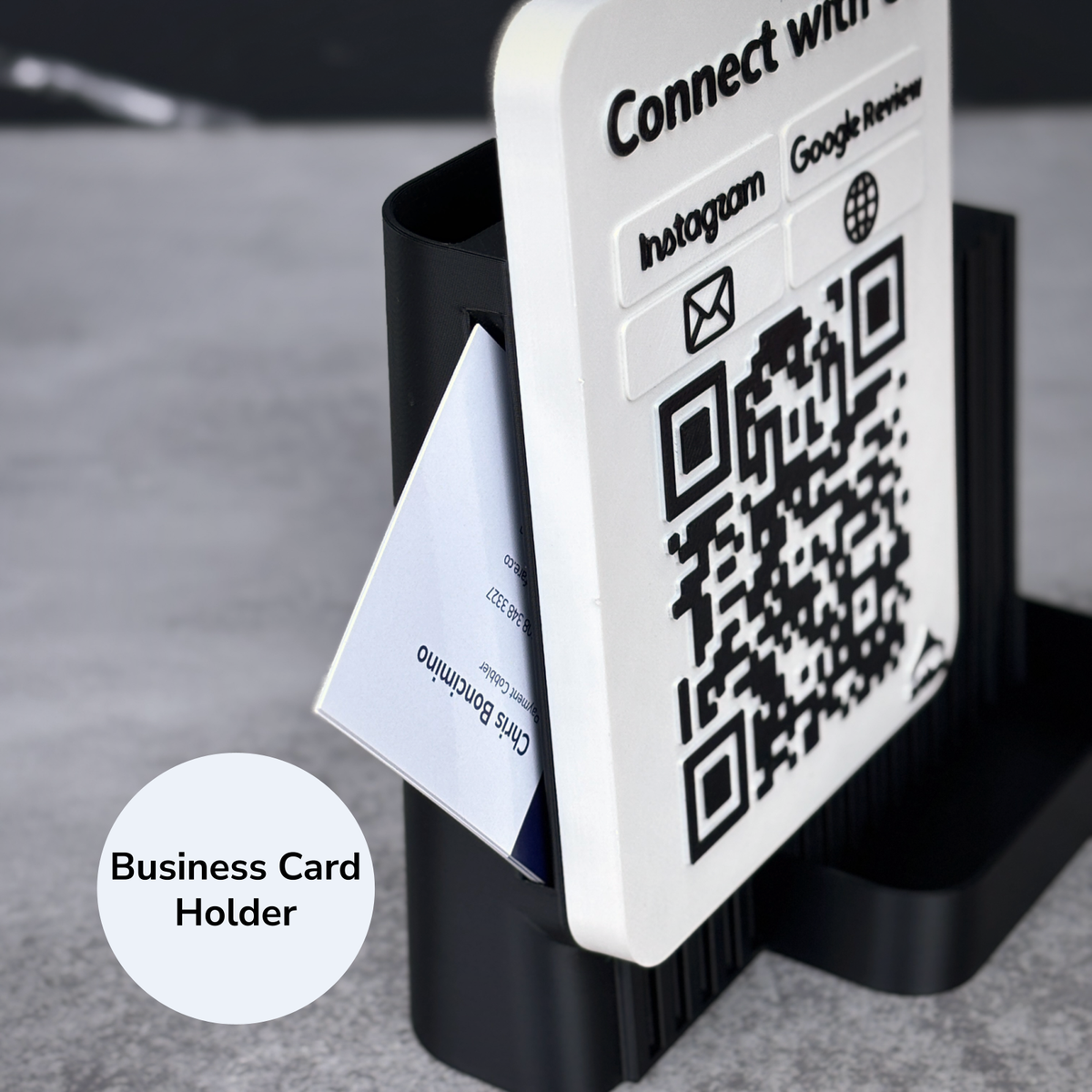 Close-up of the built-in business card holder on the side of a black Shopkeeper QR sign