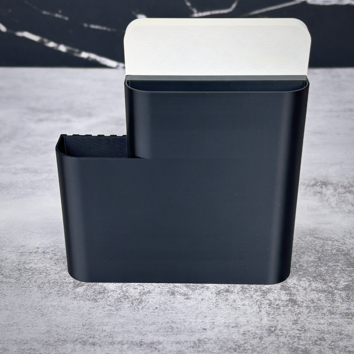 Back view of the black Shopkeeper stand showing the sign slot and organizer compartments
